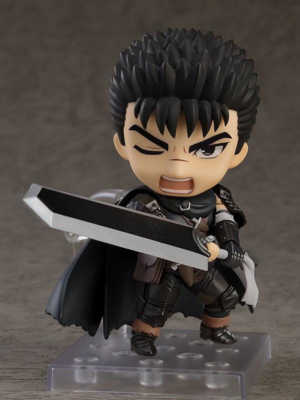 Good Smile Company Berserk Guts Nendoroid figure with serious face plate resting the Dragon Slayer sword over his shoulder on a display stand