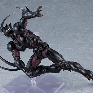 Dynamic low-crouch attack pose of figma Guyver III wielding extended High Frequency Wave-Vibration Blades.