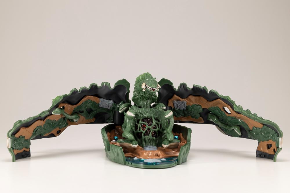 Unfolded Biollante pocket playset wide view showing central plant core and fold-out landscape panels.