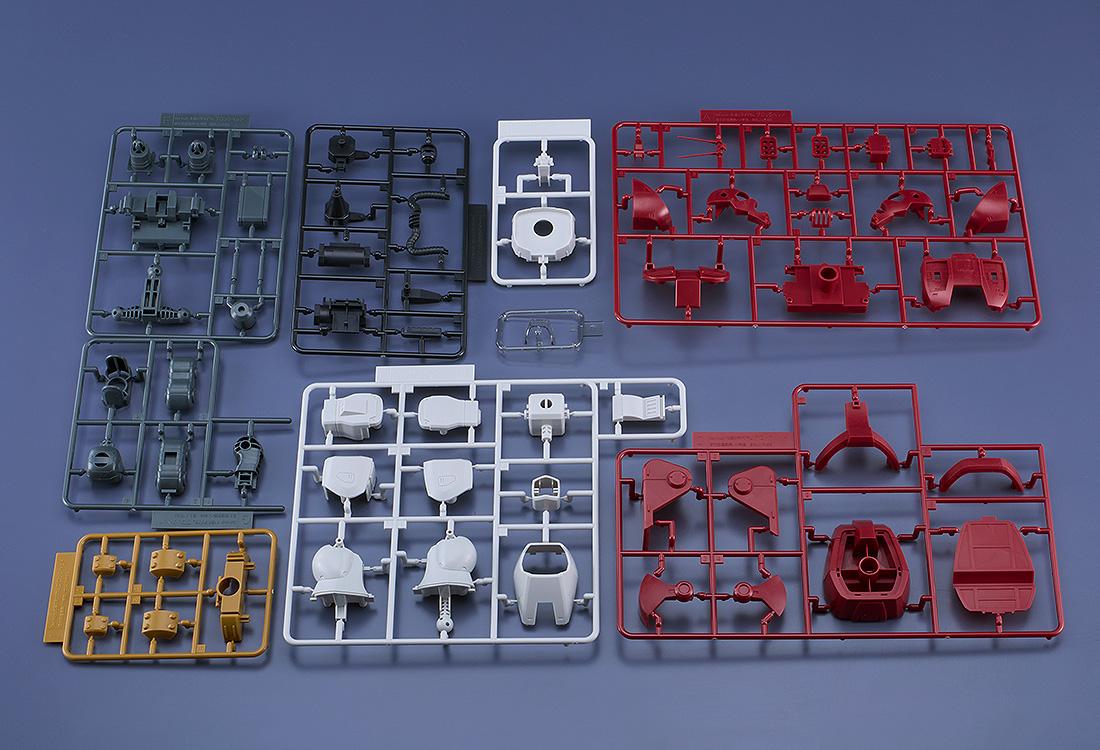 Flat lay view of the unassembled snap-fit plastic model kit sprues and colored runners for the Combat Armors MAX32 Blockhead, displaying red, white, grey, and yellow parts.