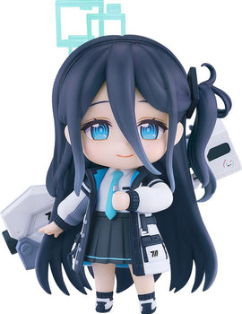 Close-up front view of the Blue Archive Aris Tendou Nendoroid figure showing her long dark blue hair, light blue eyes, and school uniform with a tie and jacket.