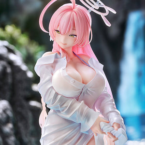 The Blue Archive Hanako scale figure photographed in a natural outdoor setting with a blurred waterfall and rocks in the background.