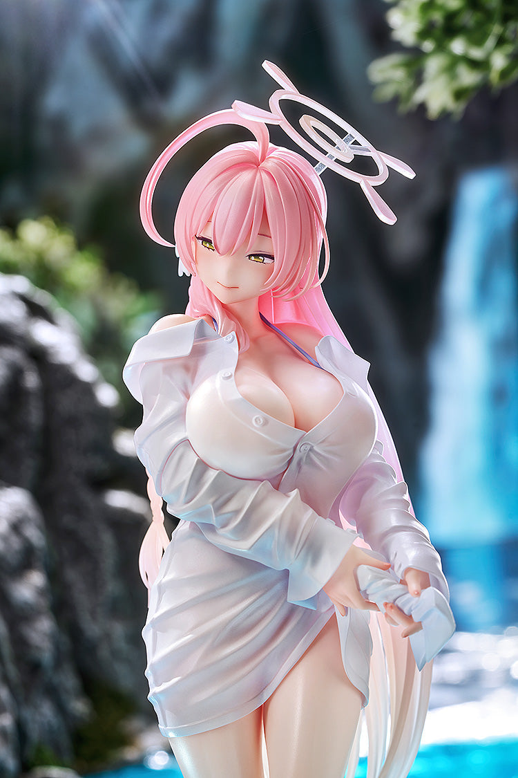 The Blue Archive Hanako scale figure photographed in a natural outdoor setting with a blurred waterfall and rocks in the background.