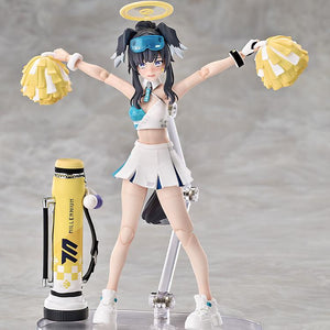 Hibiki with arms outstretched holding yellow pom-poms, posed next to her Millennium Science School mortar equipment.