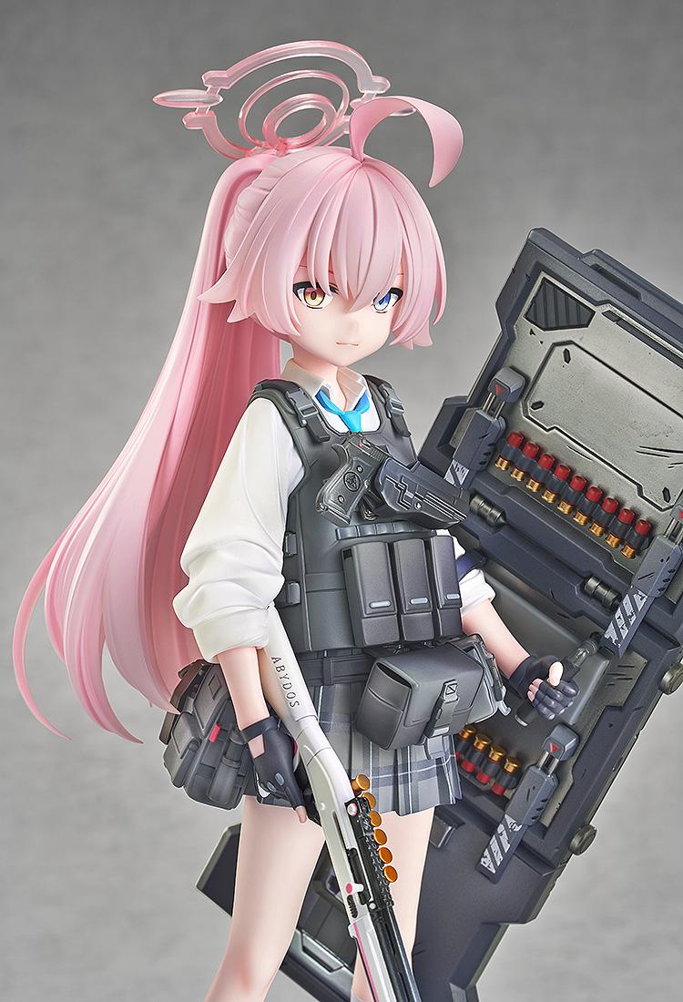 Portrait close-up of Hoshino in her battle outfit, showing her heterochromatic eyes and pink halo from Blue Archive.