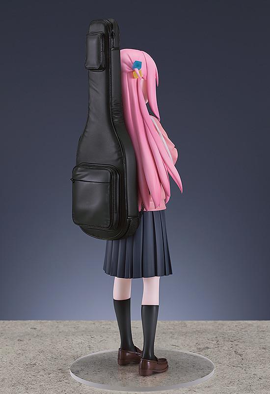 Rear view of the Hitori Gotoh figure highlighting the realistic leather texture of the black guitar case.