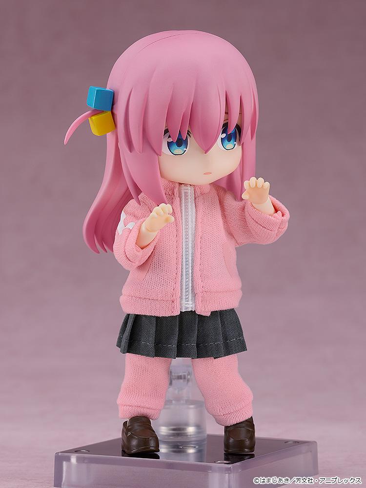 Collectible Bocchi Nendoroid Doll figure showcasing her classic layered outfit look with a grey pleated skirt worn directly over her pink tracksuit pants.