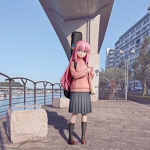 Hitori Gotoh 1/7 scale figure displayed against a realistic urban waterfront scenery background.