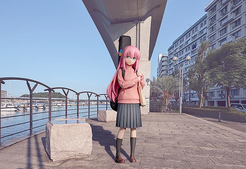 Hitori Gotoh 1/7 scale figure displayed against a realistic urban waterfront scenery background.