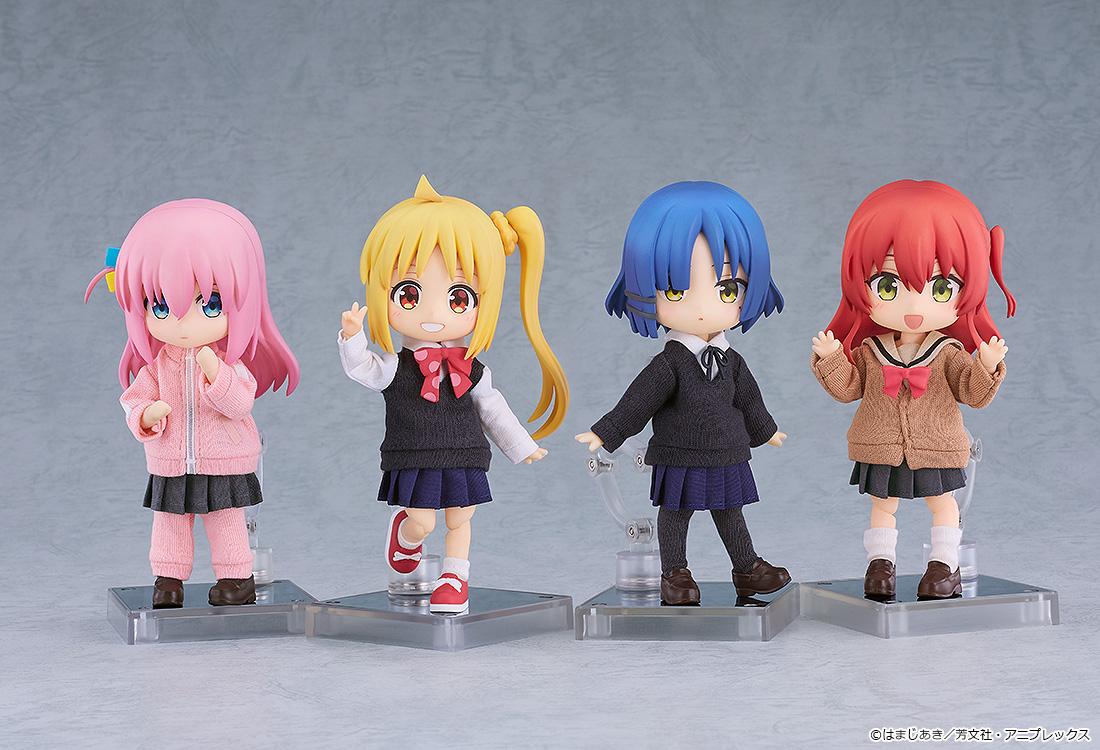 Group display featuring four Bocchi the Rock! Nendoroid Dolls standing together on their stands: Hitori Gotoh, Nijika Ijichi, Ryo Yamada, and Ikuyo Kita.
