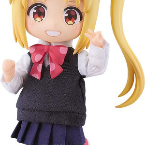 Full shot of the Bocchi the Rock! Nijika Ijichi Nendoroid Doll figure with blonde hair, a side ponytail, and a triangular ahoge, wearing a fabric school uniform and flashing a peace sign against a white background.
