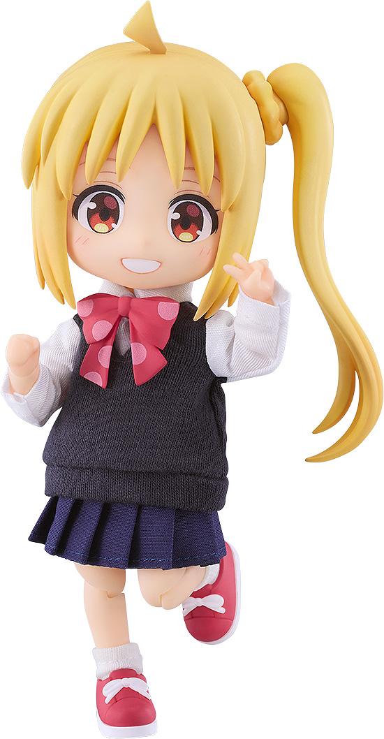 Full shot of the Bocchi the Rock! Nijika Ijichi Nendoroid Doll figure with blonde hair, a side ponytail, and a triangular ahoge, wearing a fabric school uniform and flashing a peace sign against a white background.