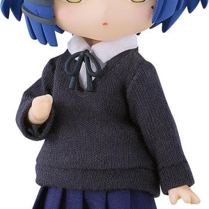 Full shot of the Bocchi the Rock! Ryo Yamada Nendoroid Doll figure featuring her signature short blue hair, grey hair clip, yellow eyes, and beauty mark, wearing a fabric school uniform against a pure white background.