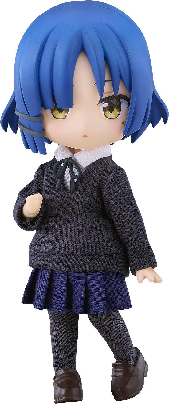 Full shot of the Bocchi the Rock! Ryo Yamada Nendoroid Doll figure featuring her signature short blue hair, grey hair clip, yellow eyes, and beauty mark, wearing a fabric school uniform against a pure white background.