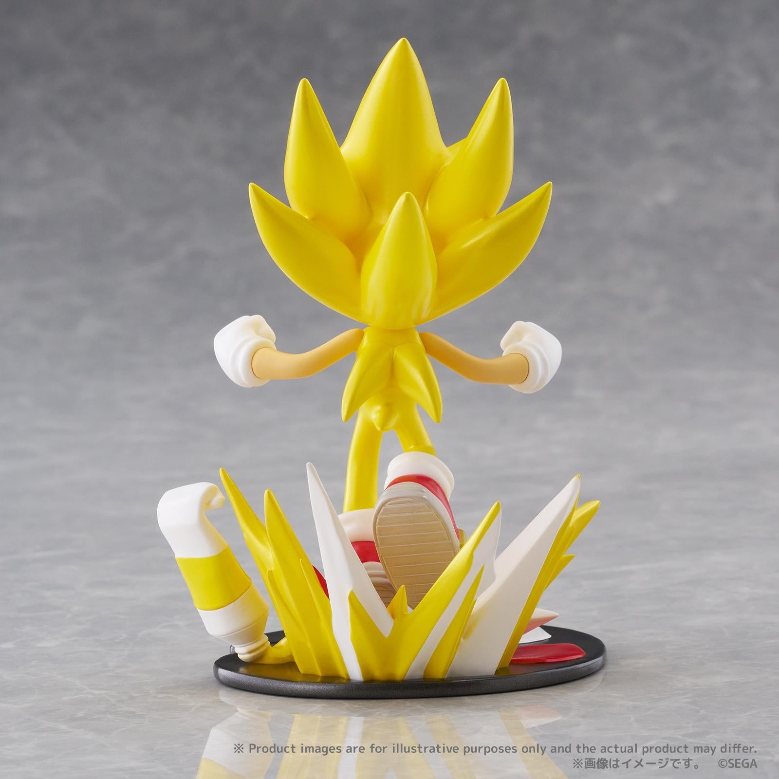 Rear view of the PalVerse Pale Super Sonic figure highlighting the back quills, shoe details, paint splash aura, and paint tube accessory on the display base.