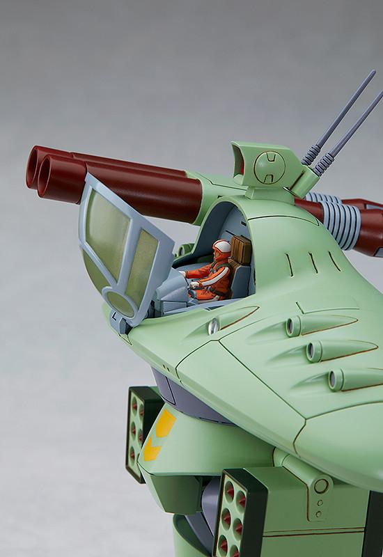 Close-up side view of the Cabarov AG9 Nicholaiev model kit with the translucent green cockpit hatch open, revealing the pre-painted pilot figure inside the seat.