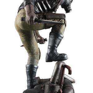 Right-side rear view of the Caiman statue, detailing his dual knife-wielding pose and the post-apocalyptic base design.