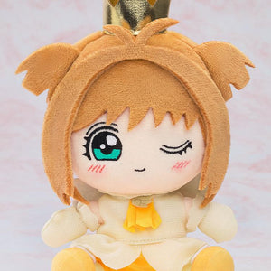 Front view product studio shot of the Sakura Kinomoto Tobira wo Akete version plushie with a winking expression against a soft pink background.