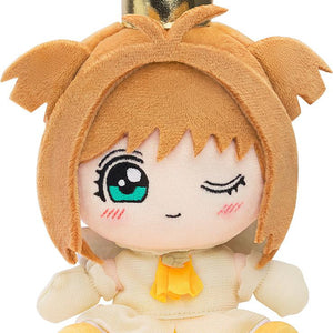 Chibi plush toy of Sakura Kinomoto from Cardcaptor Sakura in her Tobira wo Akete opening theme outfit with a gold crown on a white background.