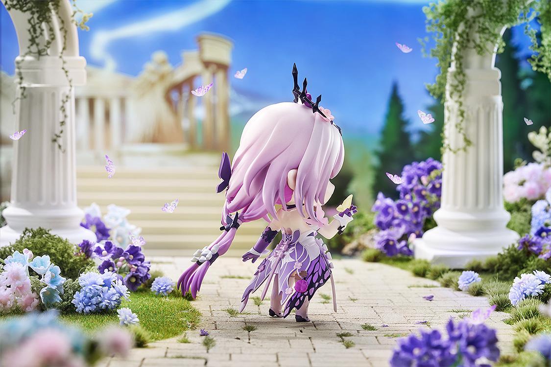 Rear view of the Castorice Nendoroid figure in the daytime temple diorama, highlighting the detailed butterfly-wing fabric pattern on the back of her purple and white dress.