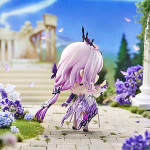 Rear view of the Castorice Nendoroid figure in the daytime temple diorama, highlighting the detailed butterfly-wing fabric pattern on the back of her purple and white dress.
