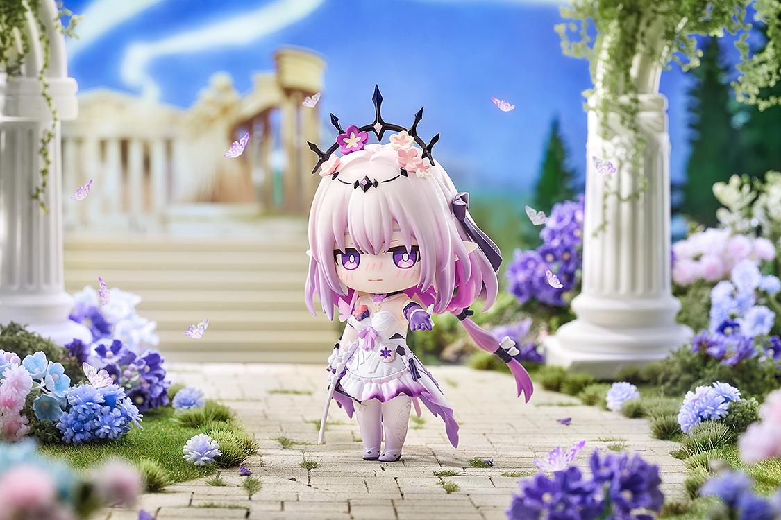 Castorice Nendoroid with a blushing expression posed in a sunlit white marble temple courtyard diorama surrounded by lush lavender blooms and floating butterflies.