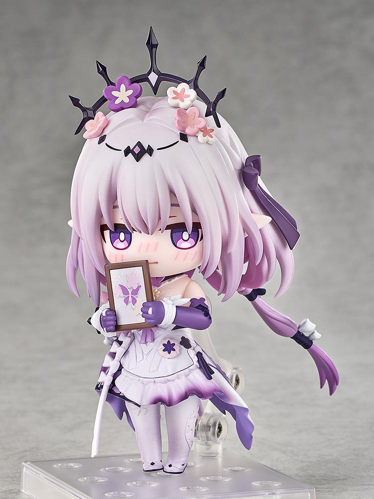 Honkai: Star Rail Castorice Nendoroid figure showcasing a blushing, embarrassed face plate while shyly holding up a tiny brown picture frame displaying a purple butterfly.