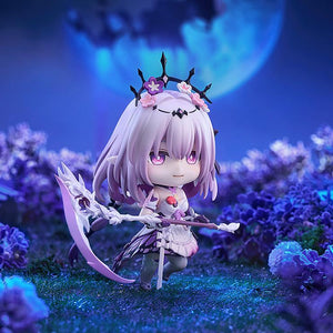 Side angle of the Castorice Nendoroid holding her scythe weapon within a detailed miniature flower field setting beneath a bright, moonlit sky.