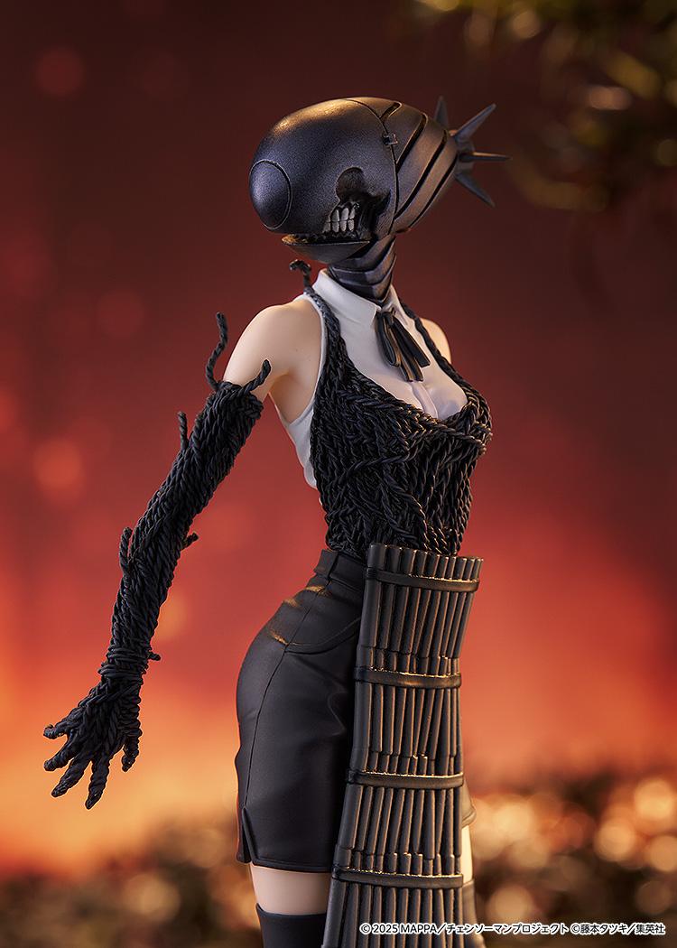 Close-up shot of the Bomb figure's upper body, focusing on the detailed teeth of the bomb head and the grenade belt.