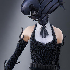 Diagonal view of the Bomb Devil figure, showcasing the full silhouette and the textured details of the explosive-themed suit.