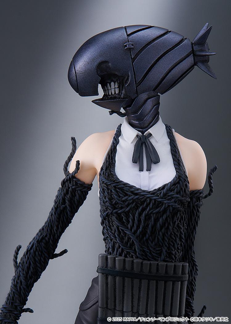 Diagonal view of the Bomb Devil figure, showcasing the full silhouette and the textured details of the explosive-themed suit.