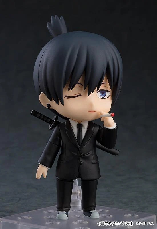 Nendoroid Aki Hayakawa figure with the one-eye-closed face plate, holding a cigarette accessory in his hand.