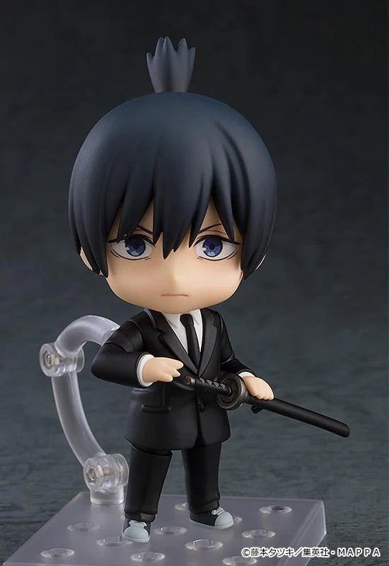Nendoroid Aki Hayakawa figure with the standard face plate, posed holding the sheathed katana, wearing his black suit.
