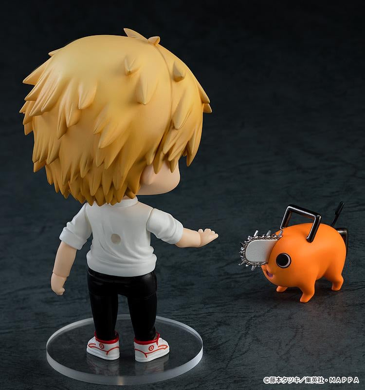 Back view of the Nendoroid Denji figure in his human form, standing next to his tiny chainsaw dog companion, Pochita.