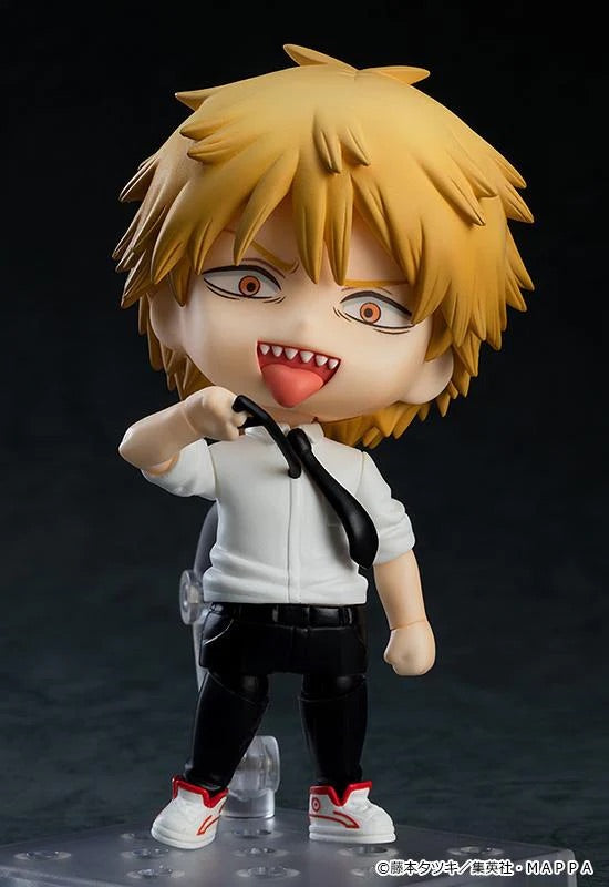 Nendoroid Denji figure in his human form with the standard face plate, posed with his tongue out and featuring his red and white shoes.