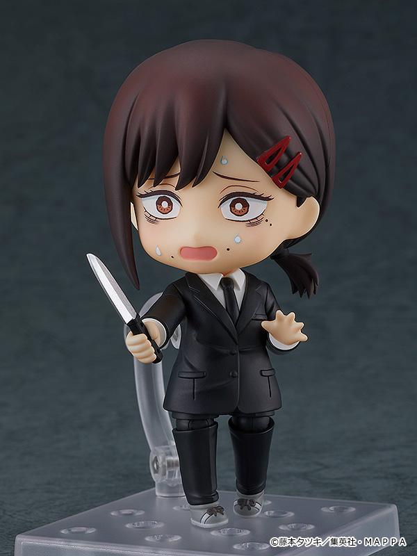 Nendoroid Kobeni figure with the nervous face plate, holding the knife accessory in a panicked combat pose.