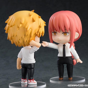 Nendoroid Makima figure reaching out, posed next to Nendoroid Denji (sold separately), showcasing the figure's scale and interaction possibilities.