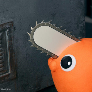 Close-up detail of Pochita's silver chainsaw blade, black handle, and glossy black eye.
