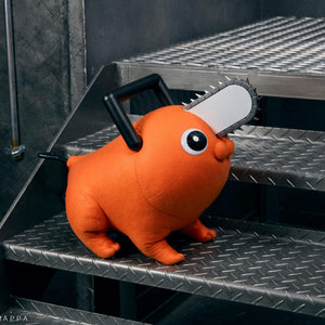 Pochita life-size plush doll standing on metal industrial stairs facing right.