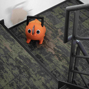High-angle shot looking down at the Pochita life-size plush doll on carpeted stairs.