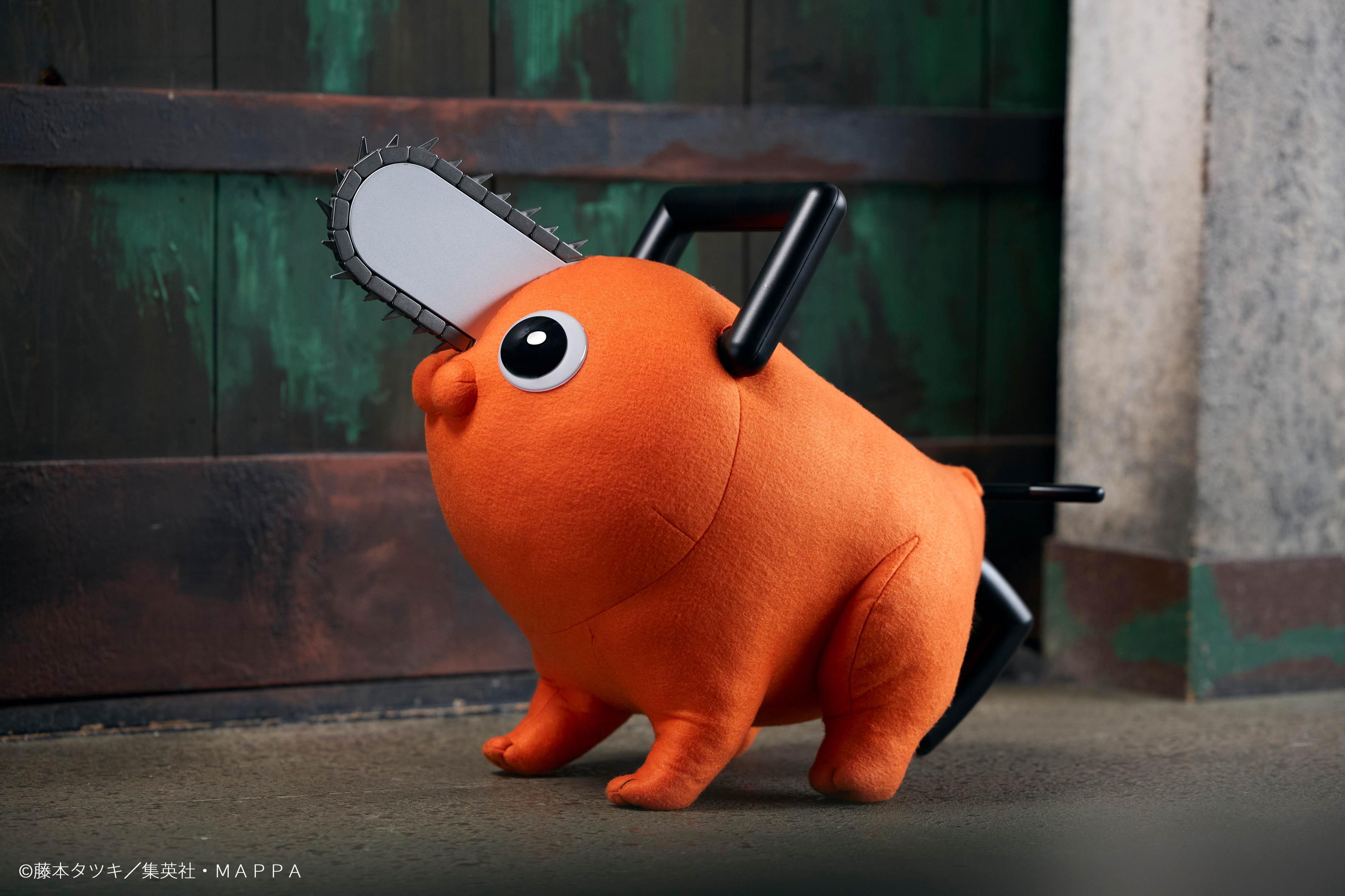 Side profile view of the Pochita life-size plush doll showing the chainsaw blade and black handle.