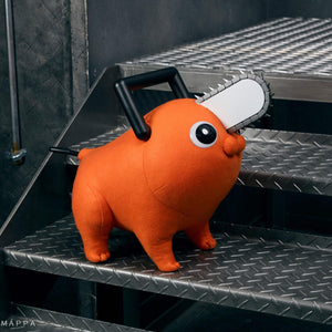 Angled front view of the Pochita life-size plush doll looking upward on diamond plate metal stairs.