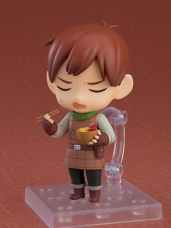 Chilchuck Nendoroid using chopsticks and holding a bowl of monster hotpot with an exasperated facial expression.