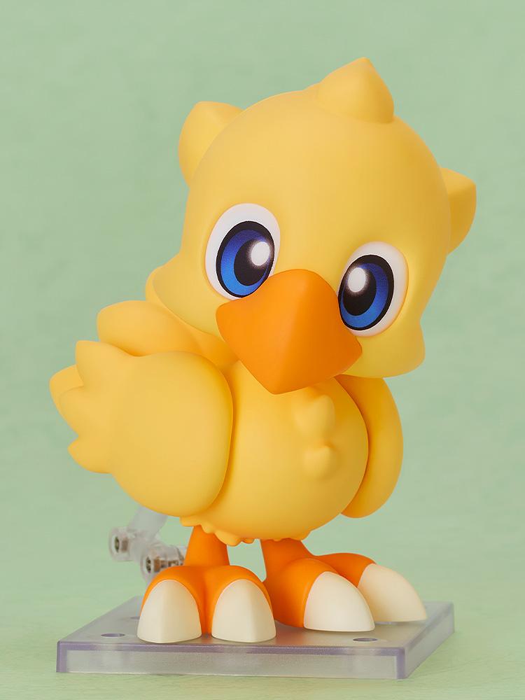 The Chocobo Nendoroid displayed on a clear stand with its standard eye face plate, featuring a slight head tilt.
