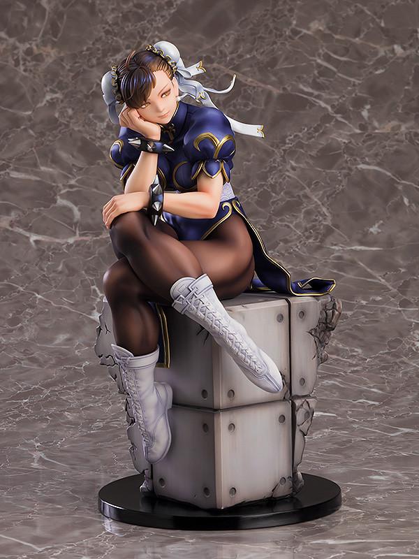 Front-facing view of the Chun-Li scale figure sitting on a grey industrial-style block base.
