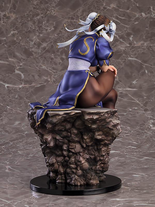 Rear view of Chun-Li statue showing hair ribbons, detailed stone base, and supple muscle sculpt.