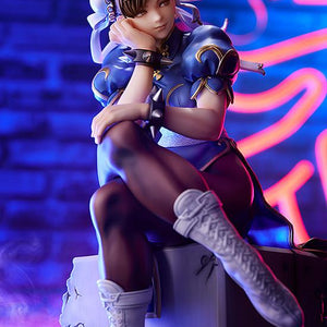 Low angle shot of Chun-Li figure under purple neon lights, highlighting her pensive expression.