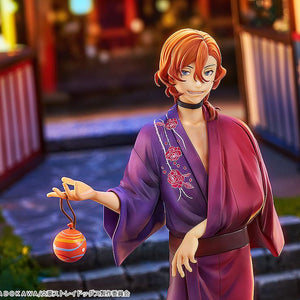 Close-up of Chuya Nakahara without his hat, highlighting his red hair and smiling expression in a festival setting.