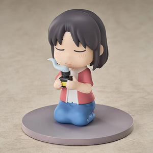 Three-quarter studio view of the non-articulated Wako Izumi Mini Memory collectible anime figure kneeling seiza-style.