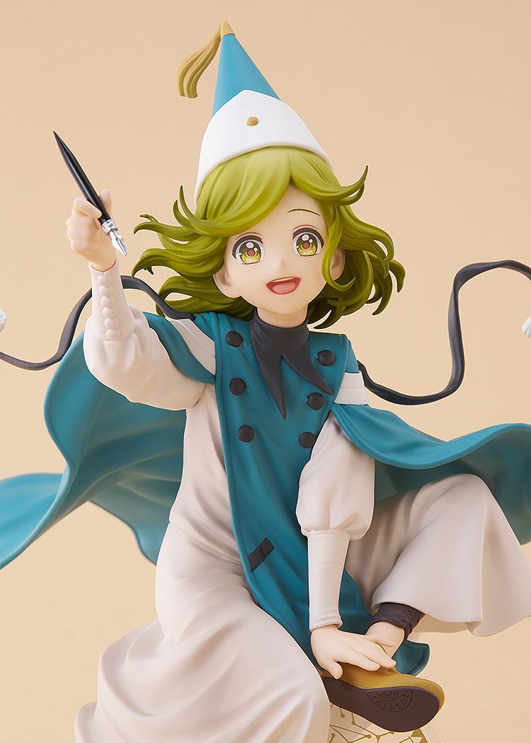 Close-up studio shot of the Coco figure highlighting her joyful expression, large golden eyes, and the detailing on her double-breasted robe.